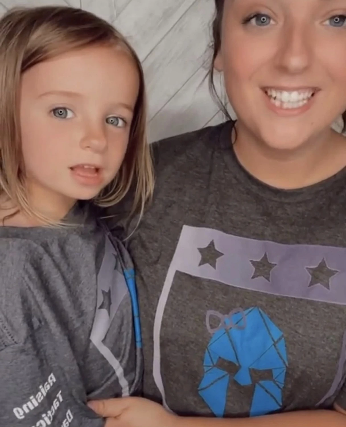 A mother and daughter wearing RTD shirts
