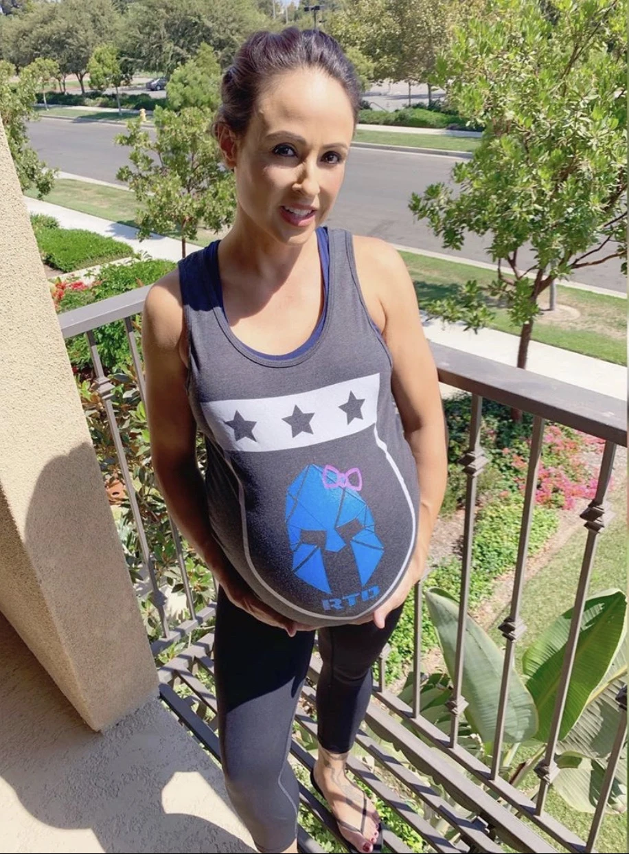 RTD supporter wearing a gray shield tank on a porch