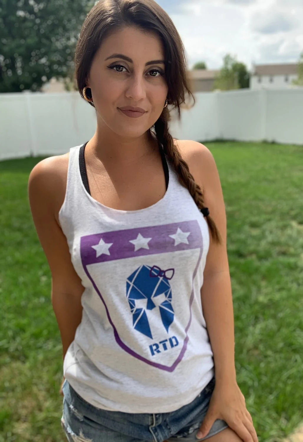 RTD supporter wearing a white tank with the shield